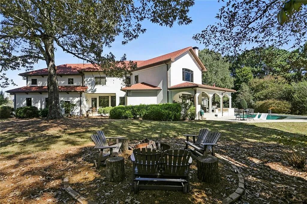 The Home in Kennesaw is the entertainers delight with large open spaces and a salt water pool with a connecting hot tub and wine cellar, now available for sale. This home located at 4235 Old Stilesboro Rd NW, Kennesaw, Georgia