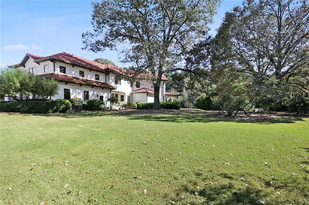 The Home in Kennesaw is the entertainers delight with large open spaces and a salt water pool with a connecting hot tub and wine cellar, now available for sale. This home located at 4235 Old Stilesboro Rd NW, Kennesaw, Georgia