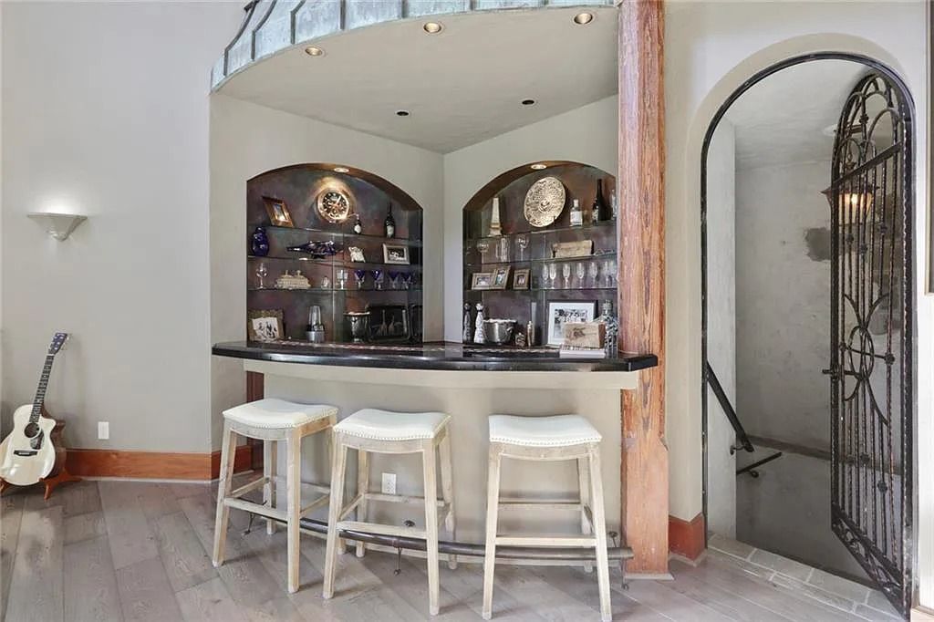 The Home in Kennesaw is the entertainers delight with large open spaces and a salt water pool with a connecting hot tub and wine cellar, now available for sale. This home located at 4235 Old Stilesboro Rd NW, Kennesaw, Georgia