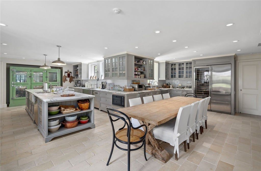 339 Duck Pond Road, Locust Valley, New York is a one of a kind home originally built in 1926 in the prestigious Village of Matinecock with exceptional amenities including a pool, pool house, tennis court, outdoor kitchen, gardens and terraces. elevator, nest system, 3,000 bottle wine cellar, art studio and more.