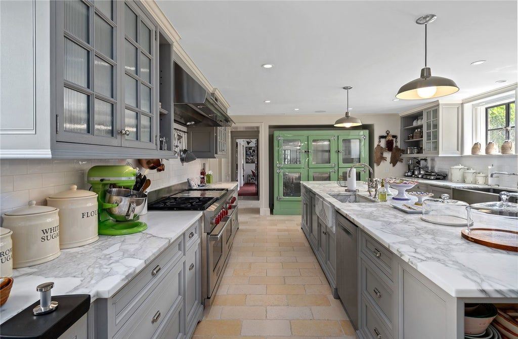 339 Duck Pond Road, Locust Valley, New York is a one of a kind home originally built in 1926 in the prestigious Village of Matinecock with exceptional amenities including a pool, pool house, tennis court, outdoor kitchen, gardens and terraces. elevator, nest system, 3,000 bottle wine cellar, art studio and more.