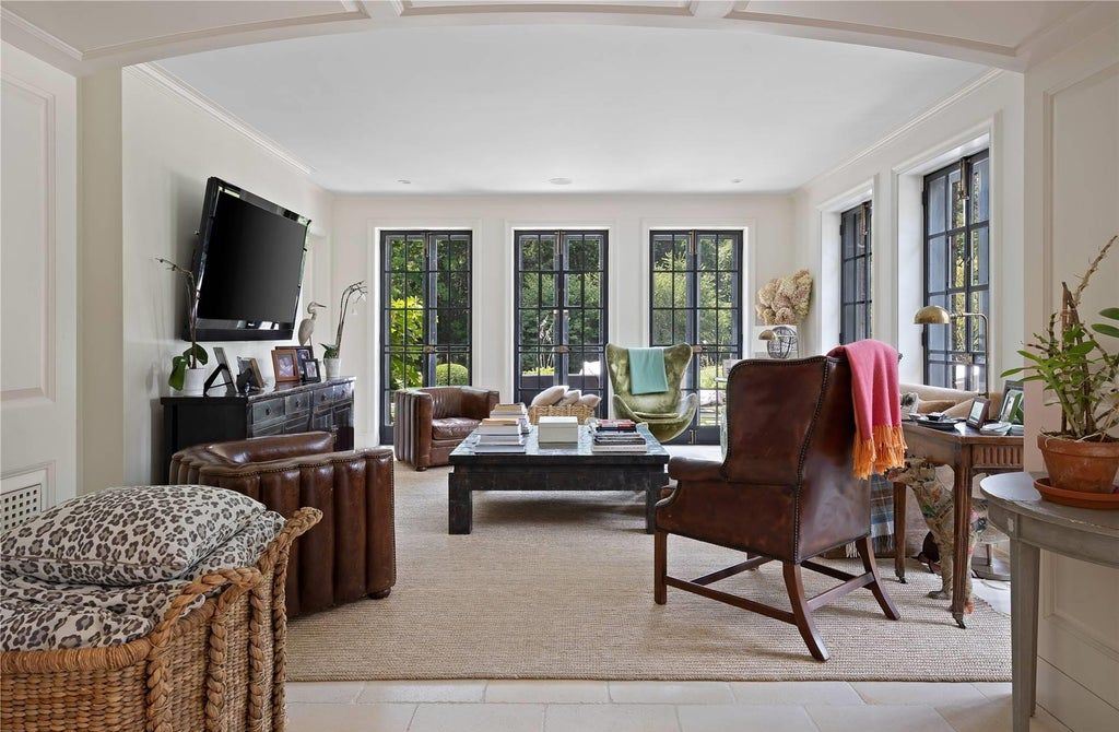 339 Duck Pond Road, Locust Valley, New York is a one of a kind home originally built in 1926 in the prestigious Village of Matinecock with exceptional amenities including a pool, pool house, tennis court, outdoor kitchen, gardens and terraces. elevator, nest system, 3,000 bottle wine cellar, art studio and more.