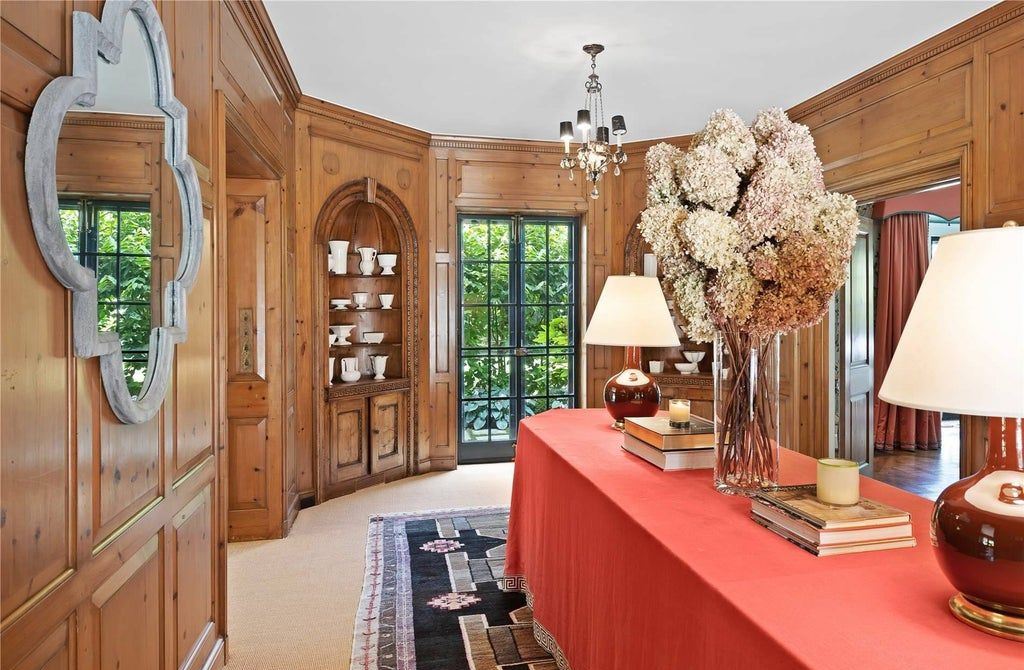 339 Duck Pond Road, Locust Valley, New York is a one of a kind home originally built in 1926 in the prestigious Village of Matinecock with exceptional amenities including a pool, pool house, tennis court, outdoor kitchen, gardens and terraces. elevator, nest system, 3,000 bottle wine cellar, art studio and more.