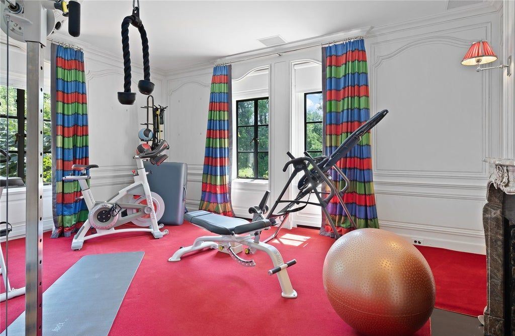 339 Duck Pond Road, Locust Valley, New York is a one of a kind home originally built in 1926 in the prestigious Village of Matinecock with exceptional amenities including a pool, pool house, tennis court, outdoor kitchen, gardens and terraces. elevator, nest system, 3,000 bottle wine cellar, art studio and more.