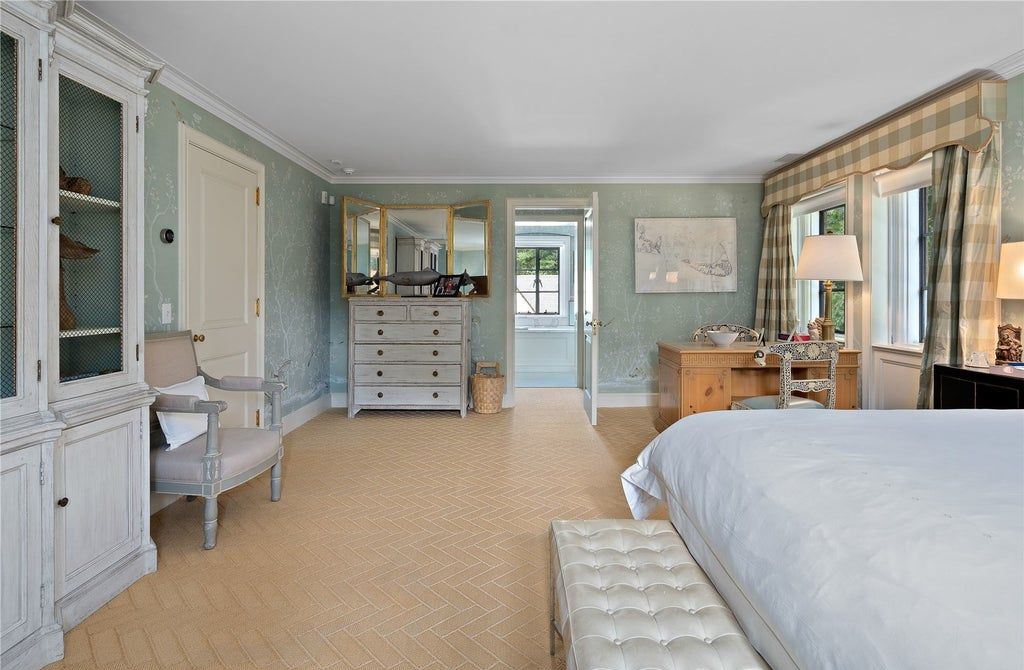 339 Duck Pond Road, Locust Valley, New York is a one of a kind home originally built in 1926 in the prestigious Village of Matinecock with exceptional amenities including a pool, pool house, tennis court, outdoor kitchen, gardens and terraces. elevator, nest system, 3,000 bottle wine cellar, art studio and more.
