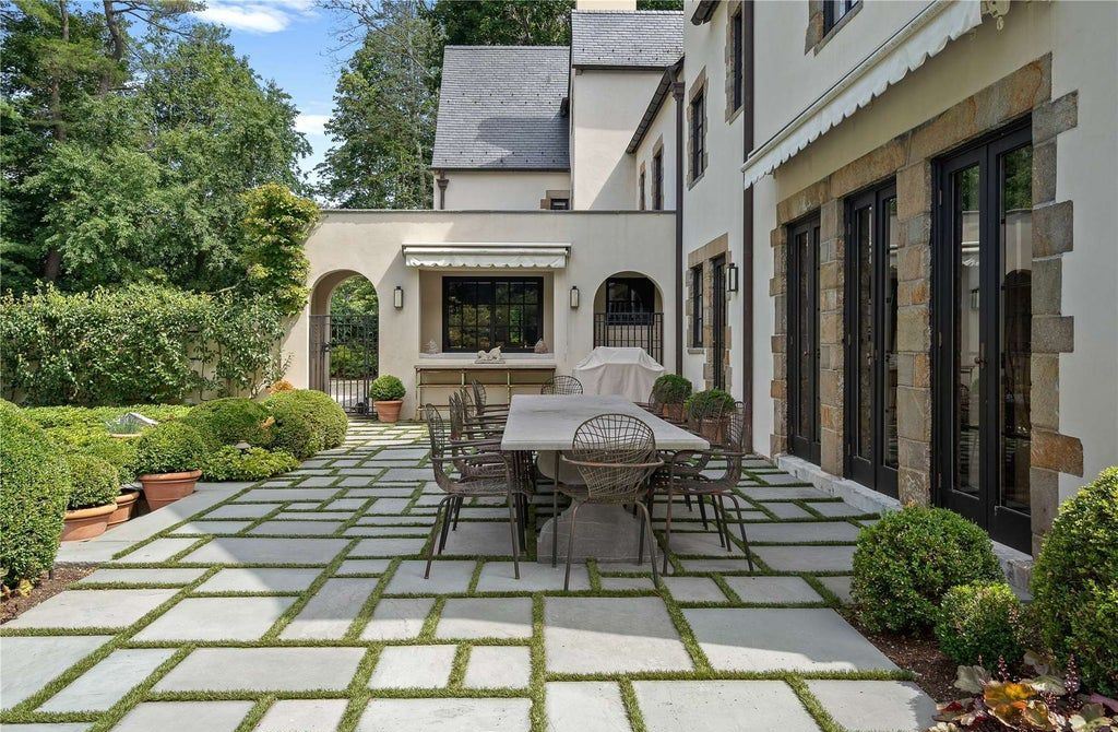 339 Duck Pond Road, Locust Valley, New York is a one of a kind home originally built in 1926 in the prestigious Village of Matinecock with exceptional amenities including a pool, pool house, tennis court, outdoor kitchen, gardens and terraces. elevator, nest system, 3,000 bottle wine cellar, art studio and more.