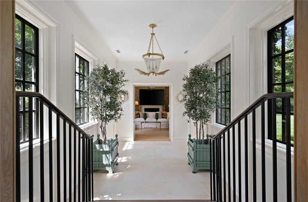 339 Duck Pond Road, Locust Valley, New York is a one of a kind home originally built in 1926 in the prestigious Village of Matinecock with exceptional amenities including a pool, pool house, tennis court, outdoor kitchen, gardens and terraces. elevator, nest system, 3,000 bottle wine cellar, art studio and more.