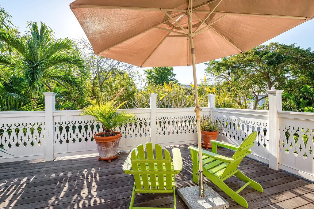 322 Elizabeth Street, Key West, Florida, was built around 1890 by ship captain Benjamin Saunders and has recently been beautifully restored. This classic revival home is located in the heart of Old Town, two blocks from downtown Duval Street and close to the historic seaport, restaurants, and attractions.