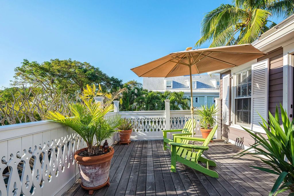 322 Elizabeth Street, Key West, Florida, was built around 1890 by ship captain Benjamin Saunders and has recently been beautifully restored. This classic revival home is located in the heart of Old Town, two blocks from downtown Duval Street and close to the historic seaport, restaurants, and attractions.