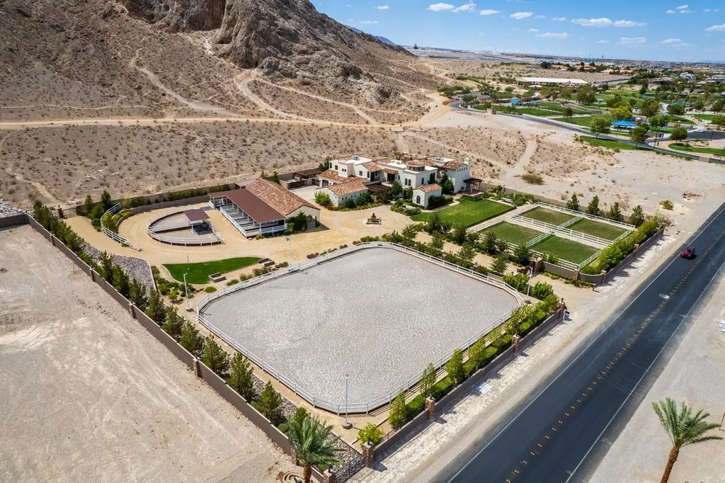 4225 N Jensen Street, Las Vegas, Nevada is a Hacienda-style home on 2.25 lush acres beaming with Spanish tile, rustic wood accents, archways, and multiple courtyards that allow for the ultimate year-round indoor outdoor living. 