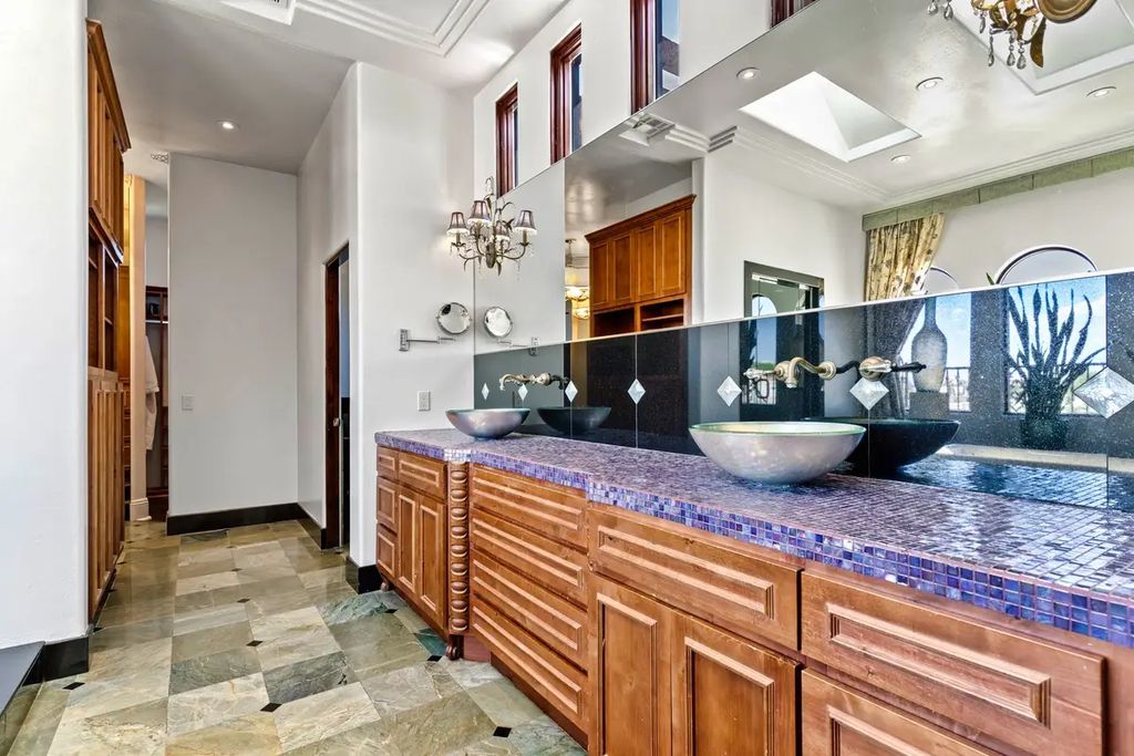 4225 N Jensen Street, Las Vegas, Nevada is a Hacienda-style home on 2.25 lush acres beaming with Spanish tile, rustic wood accents, archways, and multiple courtyards that allow for the ultimate year-round indoor outdoor living. 