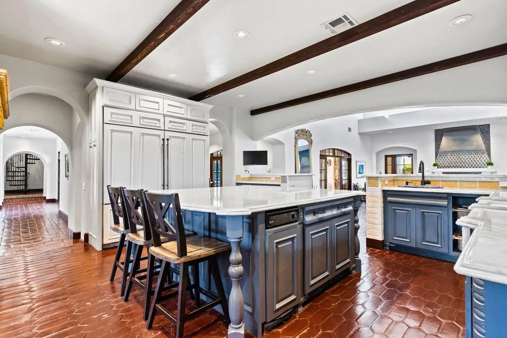 4225 N Jensen Street, Las Vegas, Nevada is a Hacienda-style home on 2.25 lush acres beaming with Spanish tile, rustic wood accents, archways, and multiple courtyards that allow for the ultimate year-round indoor outdoor living. 