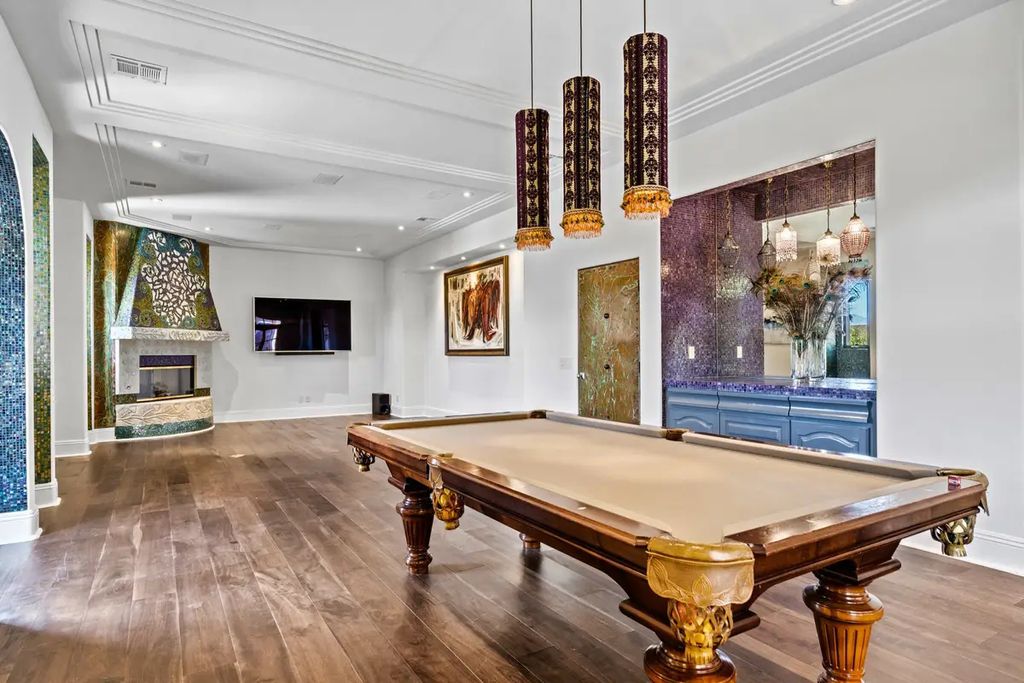 4225 N Jensen Street, Las Vegas, Nevada is a Hacienda-style home on 2.25 lush acres beaming with Spanish tile, rustic wood accents, archways, and multiple courtyards that allow for the ultimate year-round indoor outdoor living. 