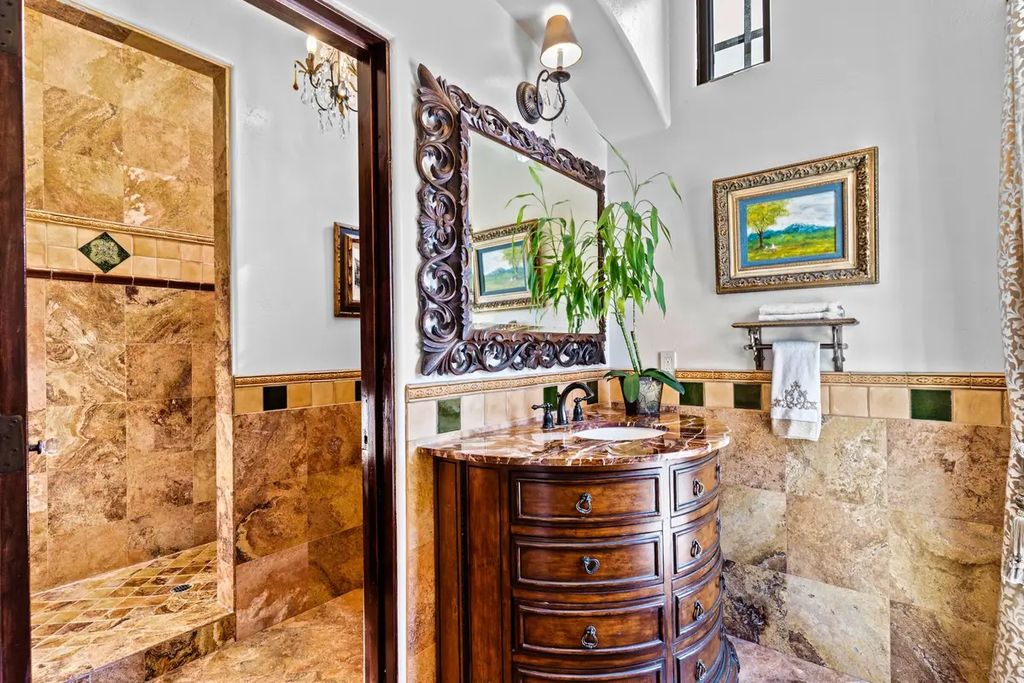 4225 N Jensen Street, Las Vegas, Nevada is a Hacienda-style home on 2.25 lush acres beaming with Spanish tile, rustic wood accents, archways, and multiple courtyards that allow for the ultimate year-round indoor outdoor living. 