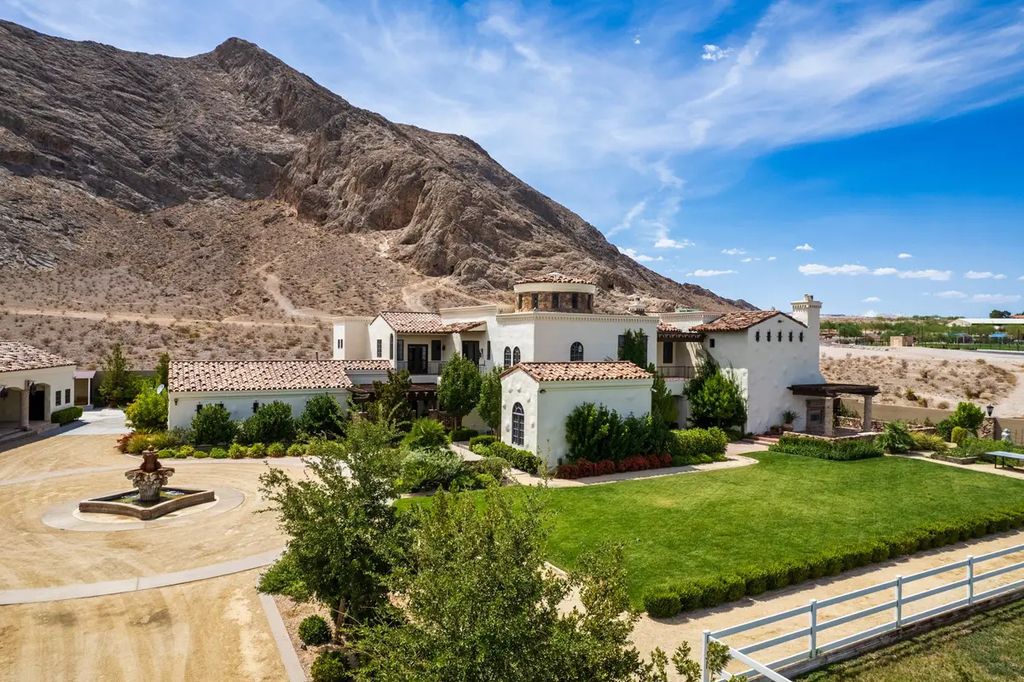 4225 N Jensen Street, Las Vegas, Nevada is a Hacienda-style home on 2.25 lush acres beaming with Spanish tile, rustic wood accents, archways, and multiple courtyards that allow for the ultimate year-round indoor outdoor living. 
