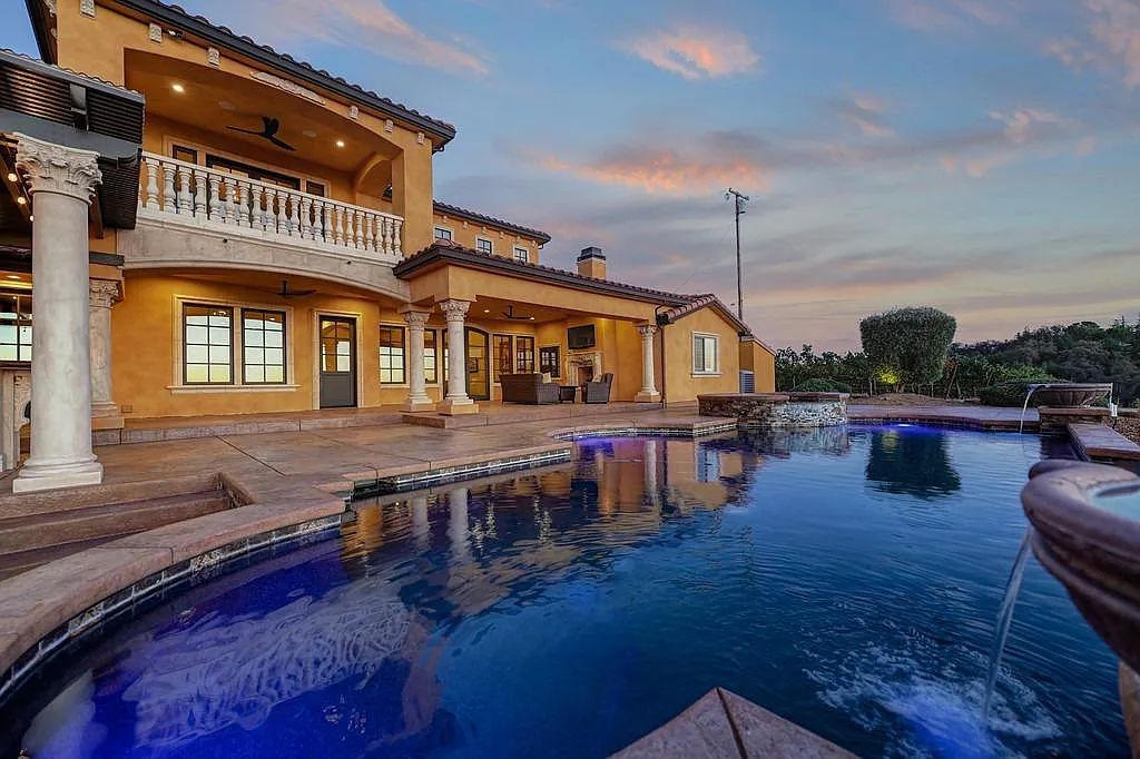 100 Shultz Vineyard Road, Shingle Springs, California is an architectural masterpiece overlooks a gorgeous working vineyard including state of the art appliances, high-end fixtures and finishes, custom iron works, and hand carved marble fireplaces and soaking tub.
