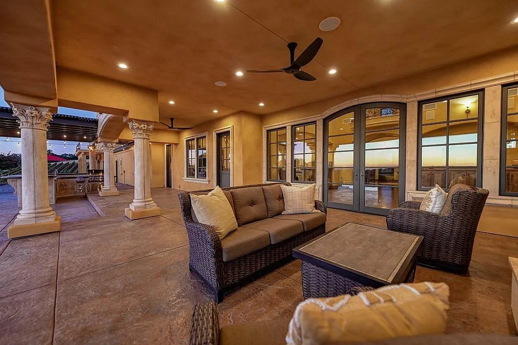 100 Shultz Vineyard Road, Shingle Springs, California is an architectural masterpiece overlooks a gorgeous working vineyard including state of the art appliances, high-end fixtures and finishes, custom iron works, and hand carved marble fireplaces and soaking tub.