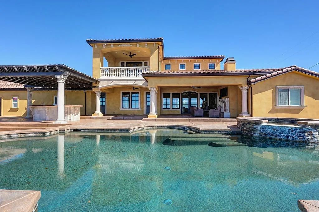 100 Shultz Vineyard Road, Shingle Springs, California is an architectural masterpiece overlooks a gorgeous working vineyard including state of the art appliances, high-end fixtures and finishes, custom iron works, and hand carved marble fireplaces and soaking tub.