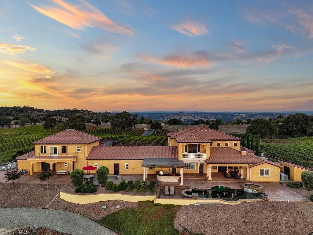 100 Shultz Vineyard Road, Shingle Springs, California is an architectural masterpiece overlooks a gorgeous working vineyard including state of the art appliances, high-end fixtures and finishes, custom iron works, and hand carved marble fireplaces and soaking tub.