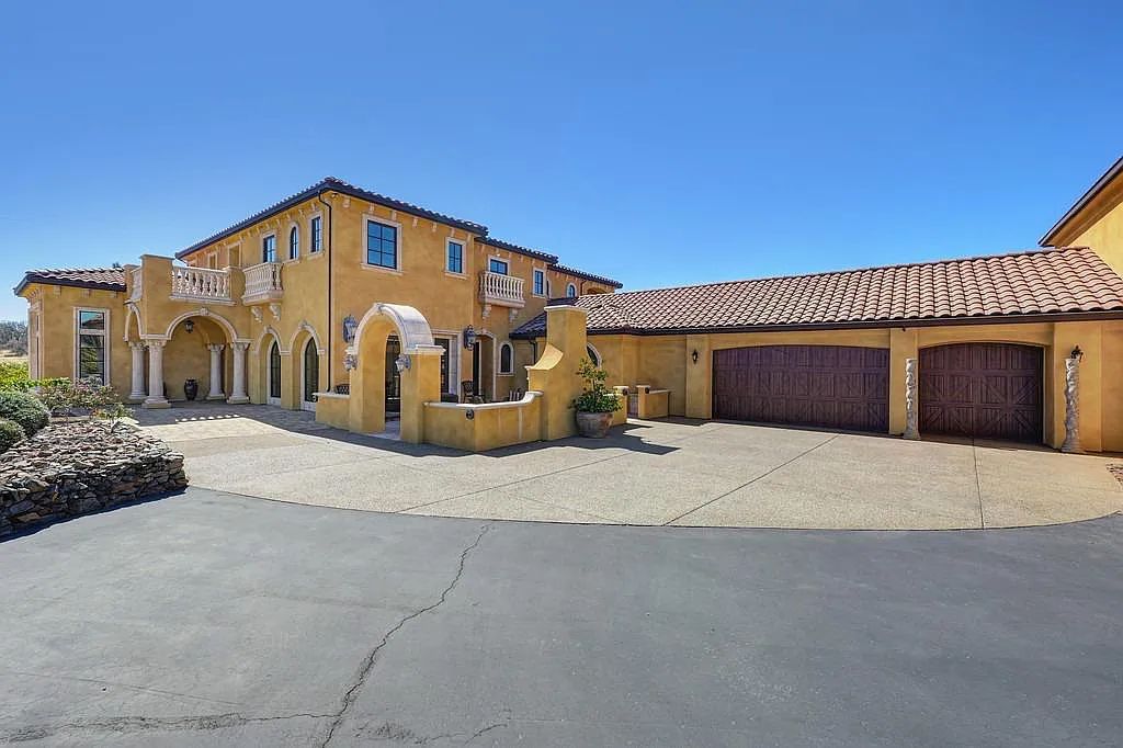 100 Shultz Vineyard Road, Shingle Springs, California is an architectural masterpiece overlooks a gorgeous working vineyard including state of the art appliances, high-end fixtures and finishes, custom iron works, and hand carved marble fireplaces and soaking tub.