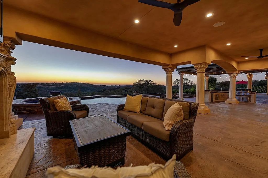 100 Shultz Vineyard Road, Shingle Springs, California is an architectural masterpiece overlooks a gorgeous working vineyard including state of the art appliances, high-end fixtures and finishes, custom iron works, and hand carved marble fireplaces and soaking tub.