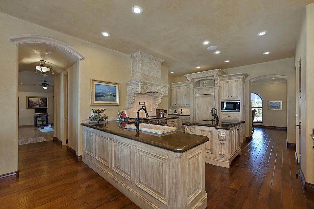 100 Shultz Vineyard Road, Shingle Springs, California is an architectural masterpiece overlooks a gorgeous working vineyard including state of the art appliances, high-end fixtures and finishes, custom iron works, and hand carved marble fireplaces and soaking tub.
