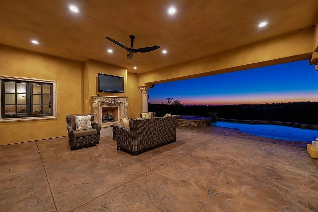 100 Shultz Vineyard Road, Shingle Springs, California is an architectural masterpiece overlooks a gorgeous working vineyard including state of the art appliances, high-end fixtures and finishes, custom iron works, and hand carved marble fireplaces and soaking tub.
