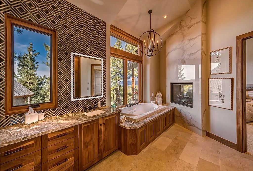 545 Eagle Drive, Incline Village, Nevada is a spectacular estate was meticulously crafted Susie Yanagi AIA design with high quality finish work including double quartzite kitchen islands, gated drive and interior paver heated courtyard.