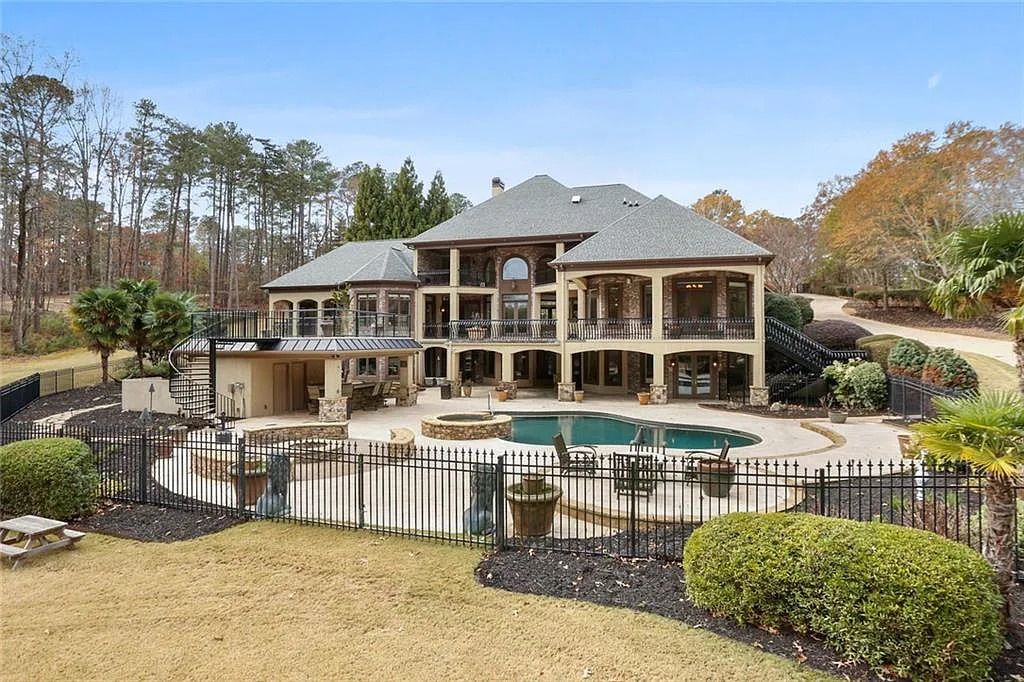 The Estate in Buford is a luxurious home offering the ultimate in privacy now available for sale. This home located at 6617 Garrett Rd, Buford, Georgia; offering 06 bedrooms and 07 bathrooms with 10,200 square feet of living spaces.