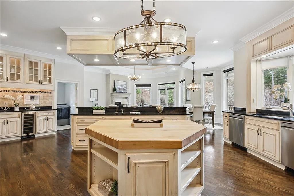 The Estate in Buford is a luxurious home offering the ultimate in privacy now available for sale. This home located at 6617 Garrett Rd, Buford, Georgia; offering 06 bedrooms and 07 bathrooms with 10,200 square feet of living spaces.