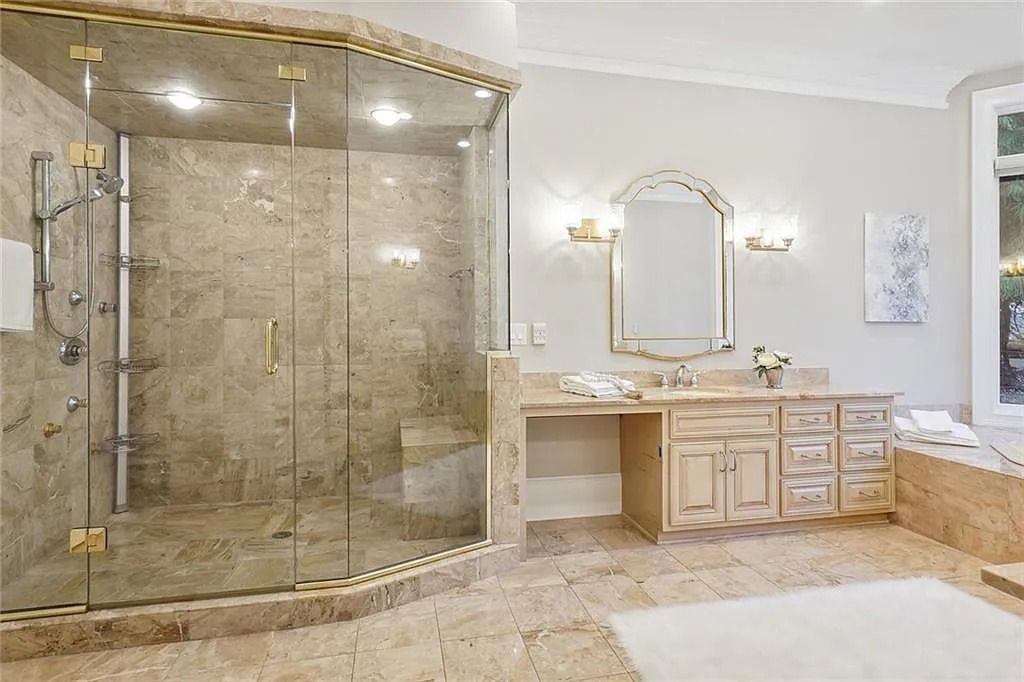 The Estate in Buford is a luxurious home offering the ultimate in privacy now available for sale. This home located at 6617 Garrett Rd, Buford, Georgia; offering 06 bedrooms and 07 bathrooms with 10,200 square feet of living spaces.