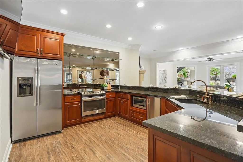 The Estate in Buford is a luxurious home offering the ultimate in privacy now available for sale. This home located at 6617 Garrett Rd, Buford, Georgia; offering 06 bedrooms and 07 bathrooms with 10,200 square feet of living spaces.