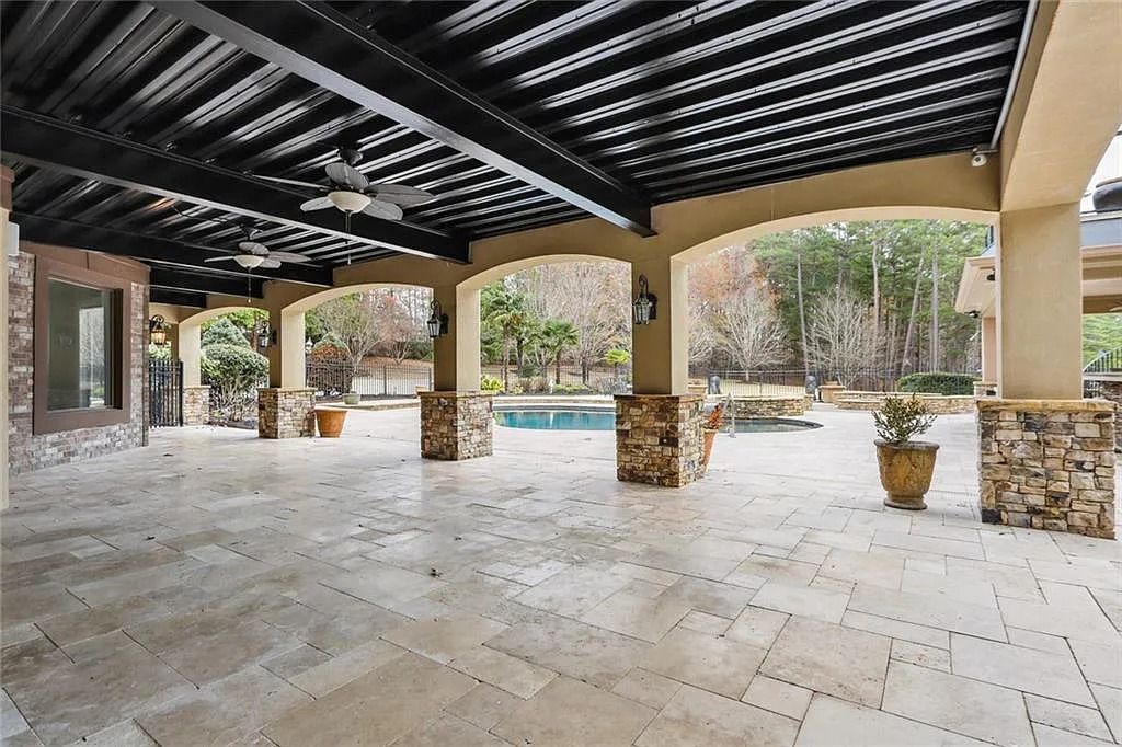 The Estate in Buford is a luxurious home offering the ultimate in privacy now available for sale. This home located at 6617 Garrett Rd, Buford, Georgia; offering 06 bedrooms and 07 bathrooms with 10,200 square feet of living spaces.