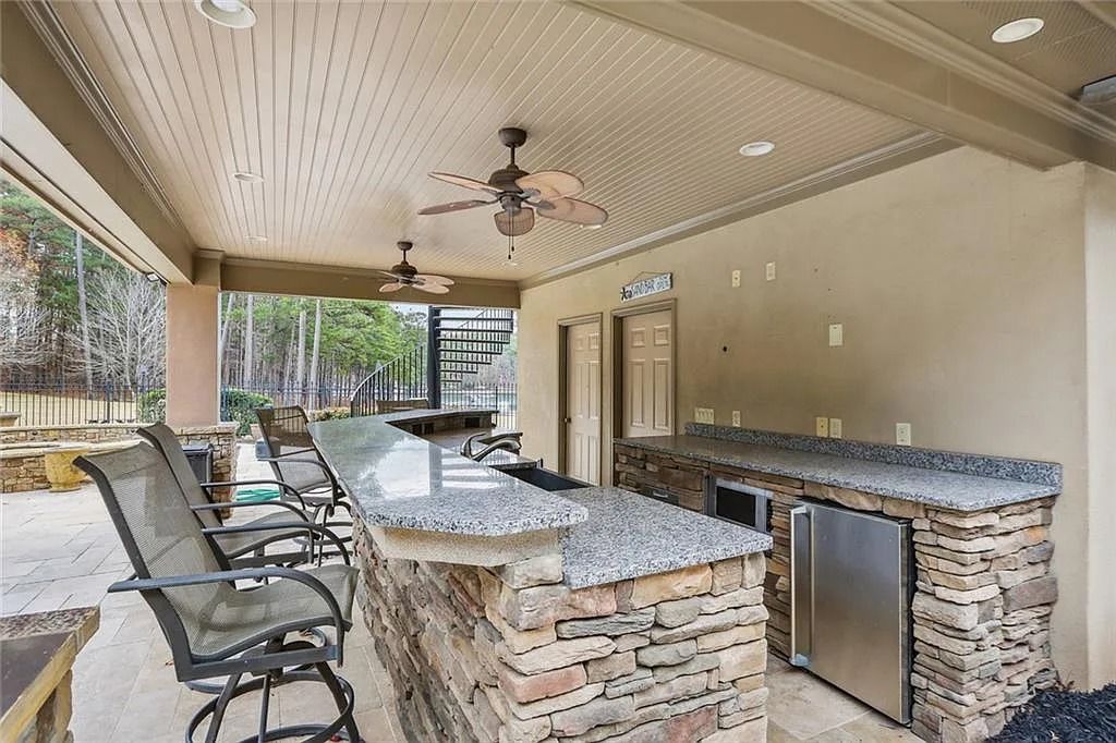 The Estate in Buford is a luxurious home offering the ultimate in privacy now available for sale. This home located at 6617 Garrett Rd, Buford, Georgia; offering 06 bedrooms and 07 bathrooms with 10,200 square feet of living spaces.