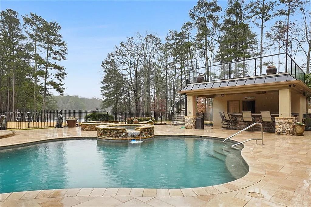 The Estate in Buford is a luxurious home offering the ultimate in privacy now available for sale. This home located at 6617 Garrett Rd, Buford, Georgia; offering 06 bedrooms and 07 bathrooms with 10,200 square feet of living spaces.