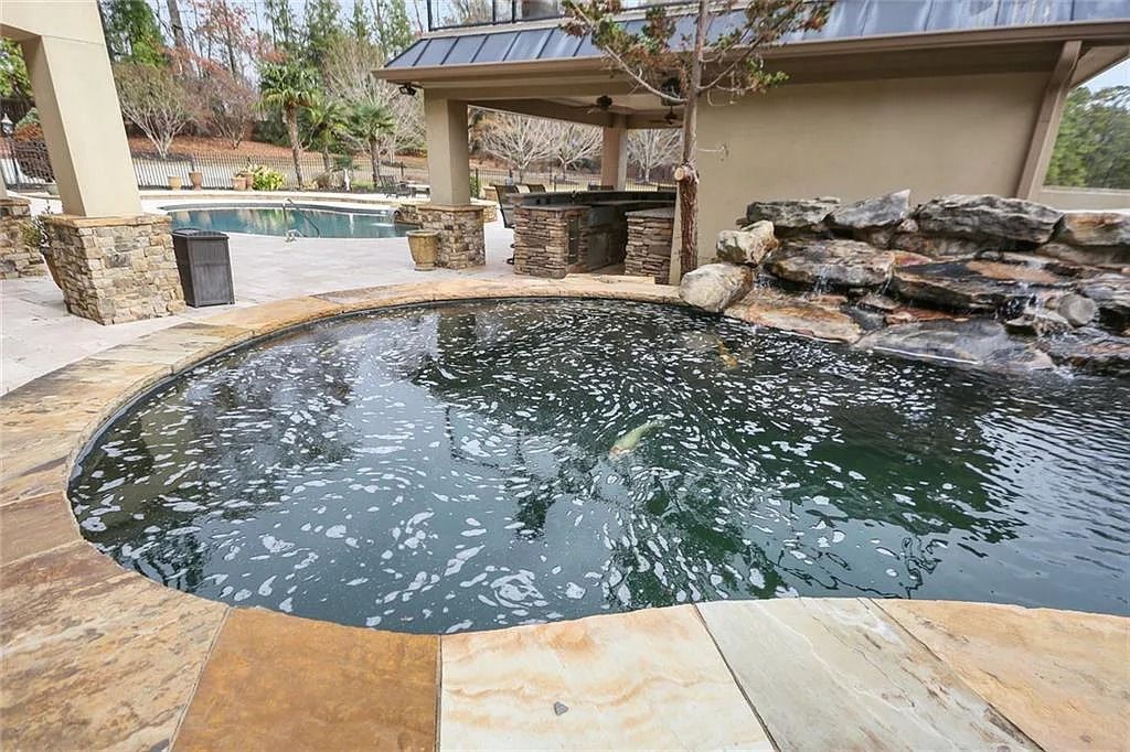 The Estate in Buford is a luxurious home offering the ultimate in privacy now available for sale. This home located at 6617 Garrett Rd, Buford, Georgia; offering 06 bedrooms and 07 bathrooms with 10,200 square feet of living spaces.