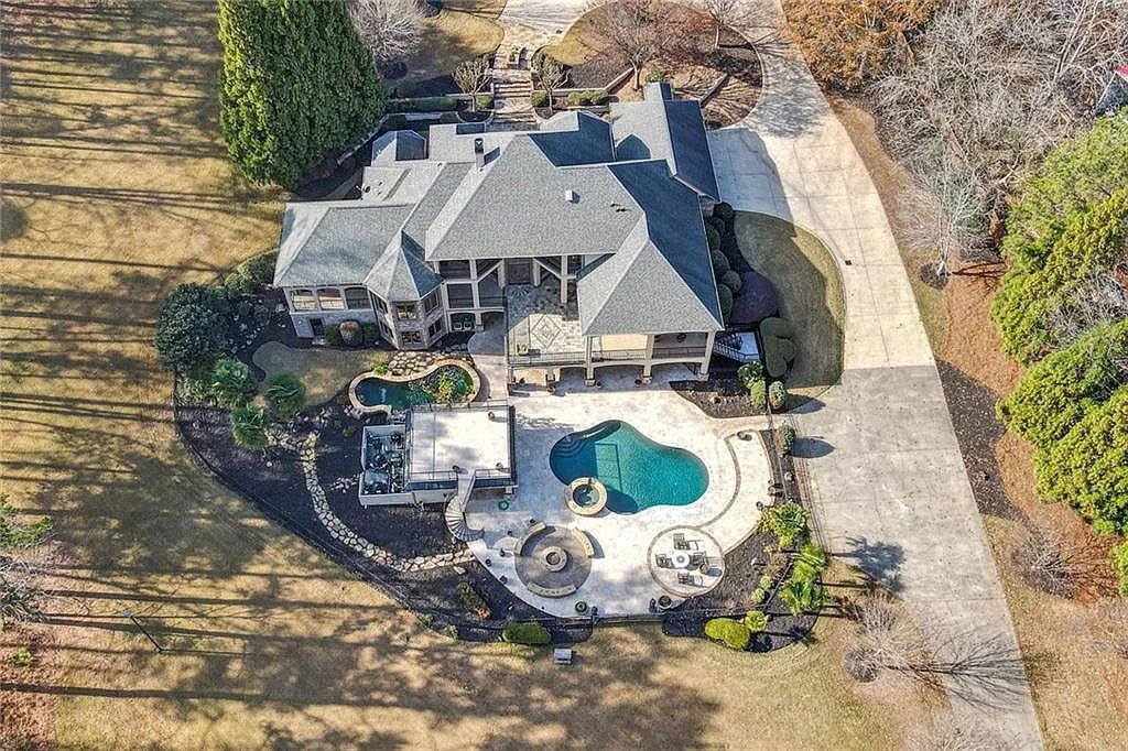 The Estate in Buford is a luxurious home offering the ultimate in privacy now available for sale. This home located at 6617 Garrett Rd, Buford, Georgia; offering 06 bedrooms and 07 bathrooms with 10,200 square feet of living spaces.