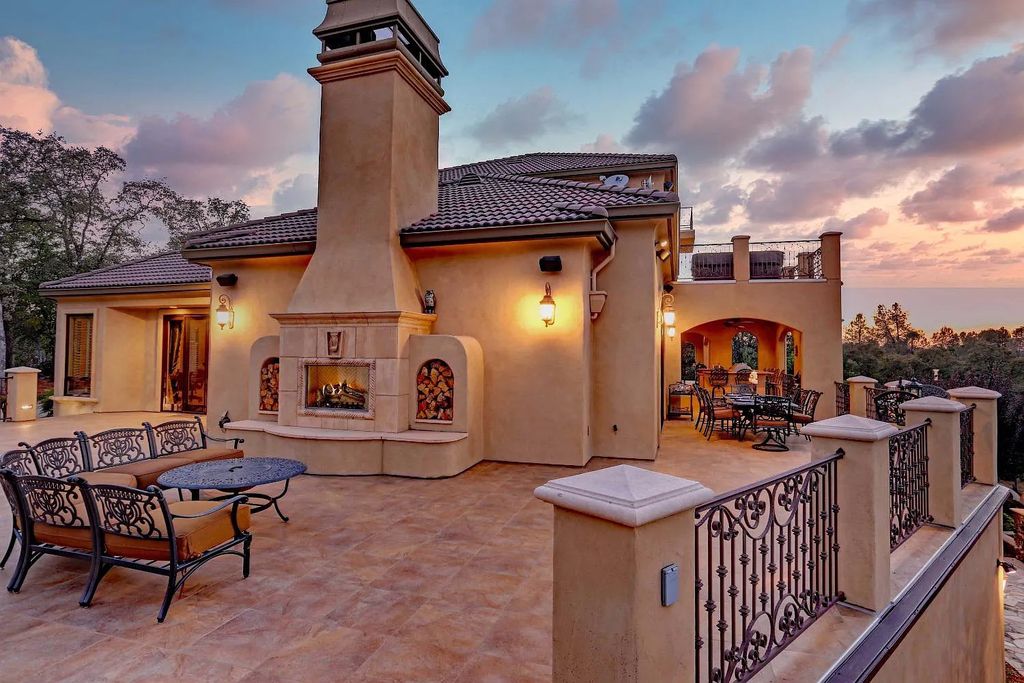 6890 Country Side Lane, Auburn, California is a magical property with fantastic theater, sports room, wine cellar, sparkling shared pond with dock, perfect spot for pool, private gated entry, tasteful landscape, equestrian trails.