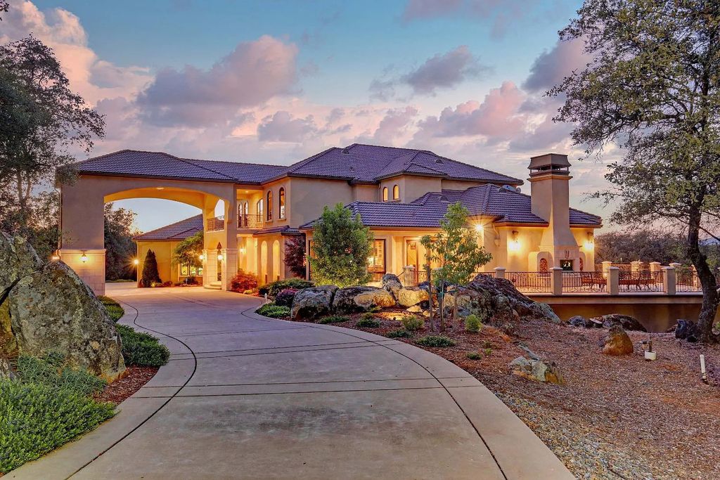 6890 Country Side Lane, Auburn, California is a magical property with fantastic theater, sports room, wine cellar, sparkling shared pond with dock, perfect spot for pool, private gated entry, tasteful landscape, equestrian trails.