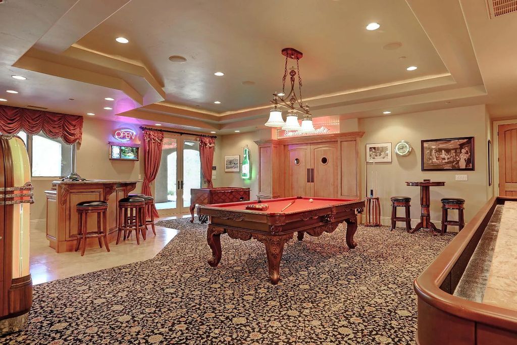 6890 Country Side Lane, Auburn, California is a magical property with fantastic theater, sports room, wine cellar, sparkling shared pond with dock, perfect spot for pool, private gated entry, tasteful landscape, equestrian trails.