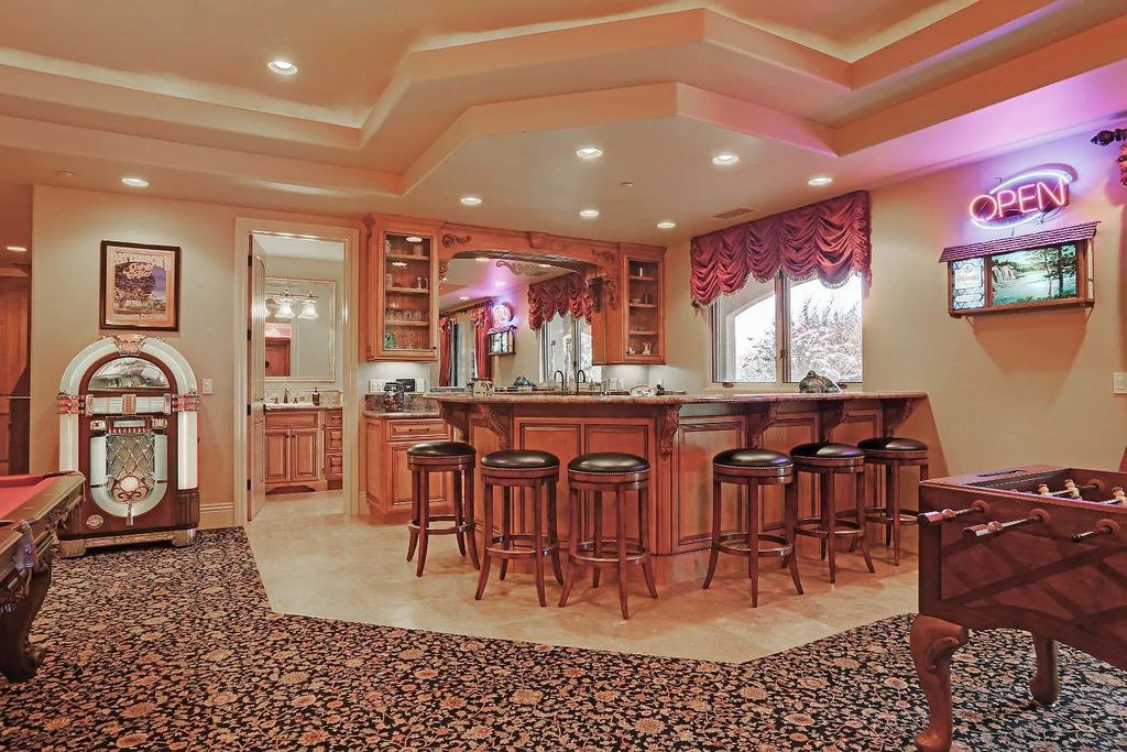6890 Country Side Lane, Auburn, California is a magical property with fantastic theater, sports room, wine cellar, sparkling shared pond with dock, perfect spot for pool, private gated entry, tasteful landscape, equestrian trails.