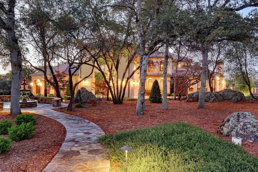 6890 Country Side Lane, Auburn, California is a magical property with fantastic theater, sports room, wine cellar, sparkling shared pond with dock, perfect spot for pool, private gated entry, tasteful landscape, equestrian trails.