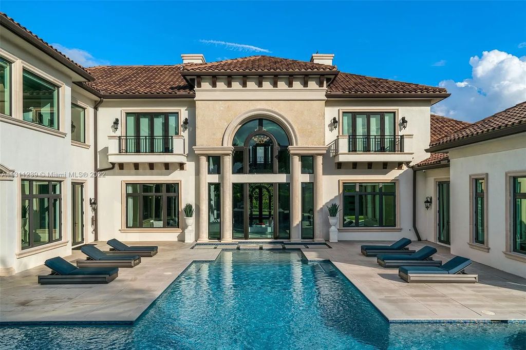 5875 Stone Creek Way, Fort Lauderdale, Florida, built by acclaimed builder Rick Bell, sits on 5 acres and boasts over 20,000 square feet of space. This incredible and one-of-a-kind custom compound's grand estate, including private gates, features volume ceilings, a resort-style pool, and top-of-the-line appliances.