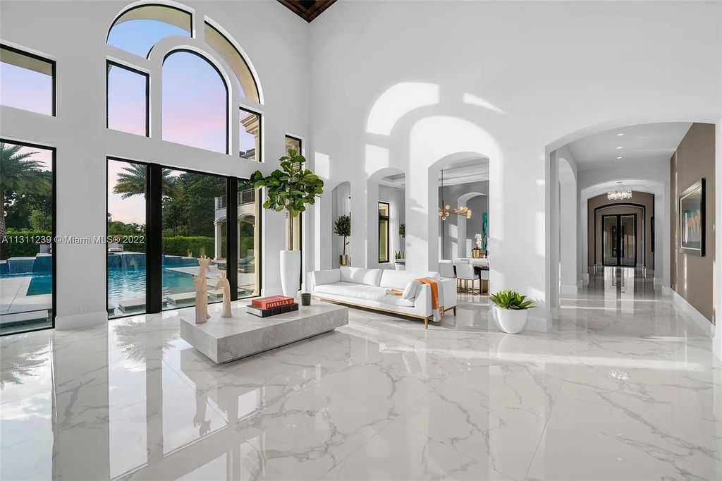 5875 Stone Creek Way, Fort Lauderdale, Florida, built by acclaimed builder Rick Bell, sits on 5 acres and boasts over 20,000 square feet of space. This incredible and one-of-a-kind custom compound's grand estate, including private gates, features volume ceilings, a resort-style pool, and top-of-the-line appliances.