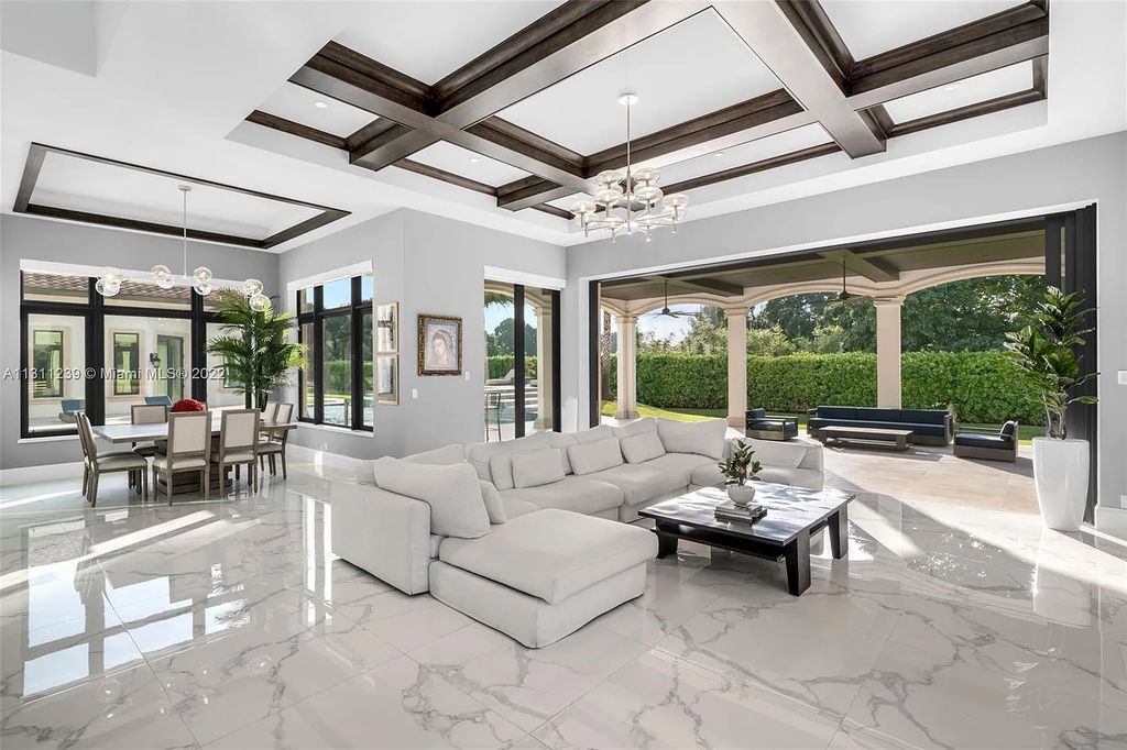 5875 Stone Creek Way, Fort Lauderdale, Florida, built by acclaimed builder Rick Bell, sits on 5 acres and boasts over 20,000 square feet of space. This incredible and one-of-a-kind custom compound's grand estate, including private gates, features volume ceilings, a resort-style pool, and top-of-the-line appliances.
