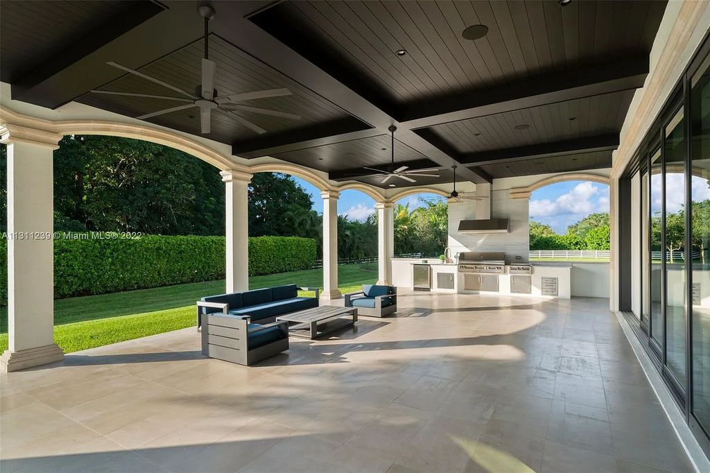 5875 Stone Creek Way, Fort Lauderdale, Florida, built by acclaimed builder Rick Bell, sits on 5 acres and boasts over 20,000 square feet of space. This incredible and one-of-a-kind custom compound's grand estate, including private gates, features volume ceilings, a resort-style pool, and top-of-the-line appliances.