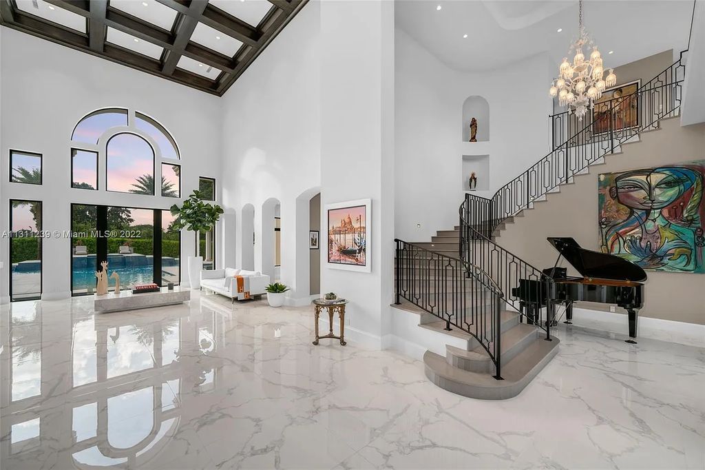 5875 Stone Creek Way, Fort Lauderdale, Florida, built by acclaimed builder Rick Bell, sits on 5 acres and boasts over 20,000 square feet of space. This incredible and one-of-a-kind custom compound's grand estate, including private gates, features volume ceilings, a resort-style pool, and top-of-the-line appliances.