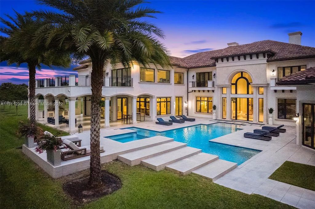 5875 Stone Creek Way, Fort Lauderdale, Florida, built by acclaimed builder Rick Bell, sits on 5 acres and boasts over 20,000 square feet of space. This incredible and one-of-a-kind custom compound's grand estate, including private gates, features volume ceilings, a resort-style pool, and top-of-the-line appliances.