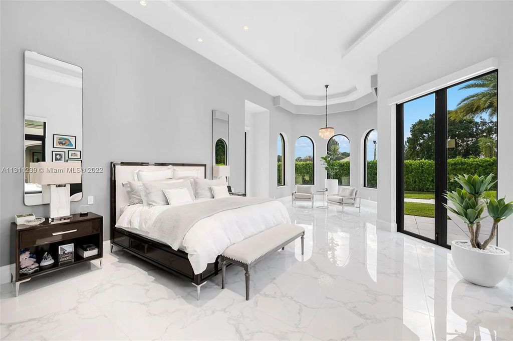5875 Stone Creek Way, Fort Lauderdale, Florida, built by acclaimed builder Rick Bell, sits on 5 acres and boasts over 20,000 square feet of space. This incredible and one-of-a-kind custom compound's grand estate, including private gates, features volume ceilings, a resort-style pool, and top-of-the-line appliances.