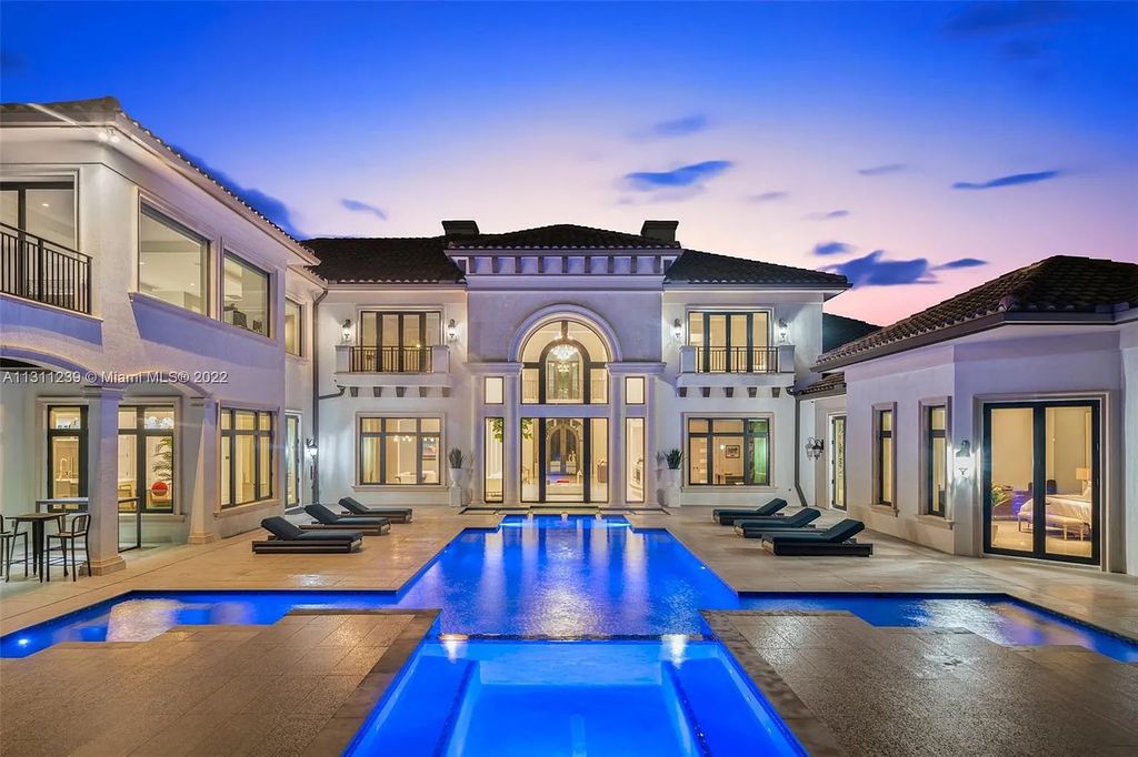 5875 Stone Creek Way, Fort Lauderdale, Florida, built by acclaimed builder Rick Bell, sits on 5 acres and boasts over 20,000 square feet of space. This incredible and one-of-a-kind custom compound's grand estate, including private gates, features volume ceilings, a resort-style pool, and top-of-the-line appliances.